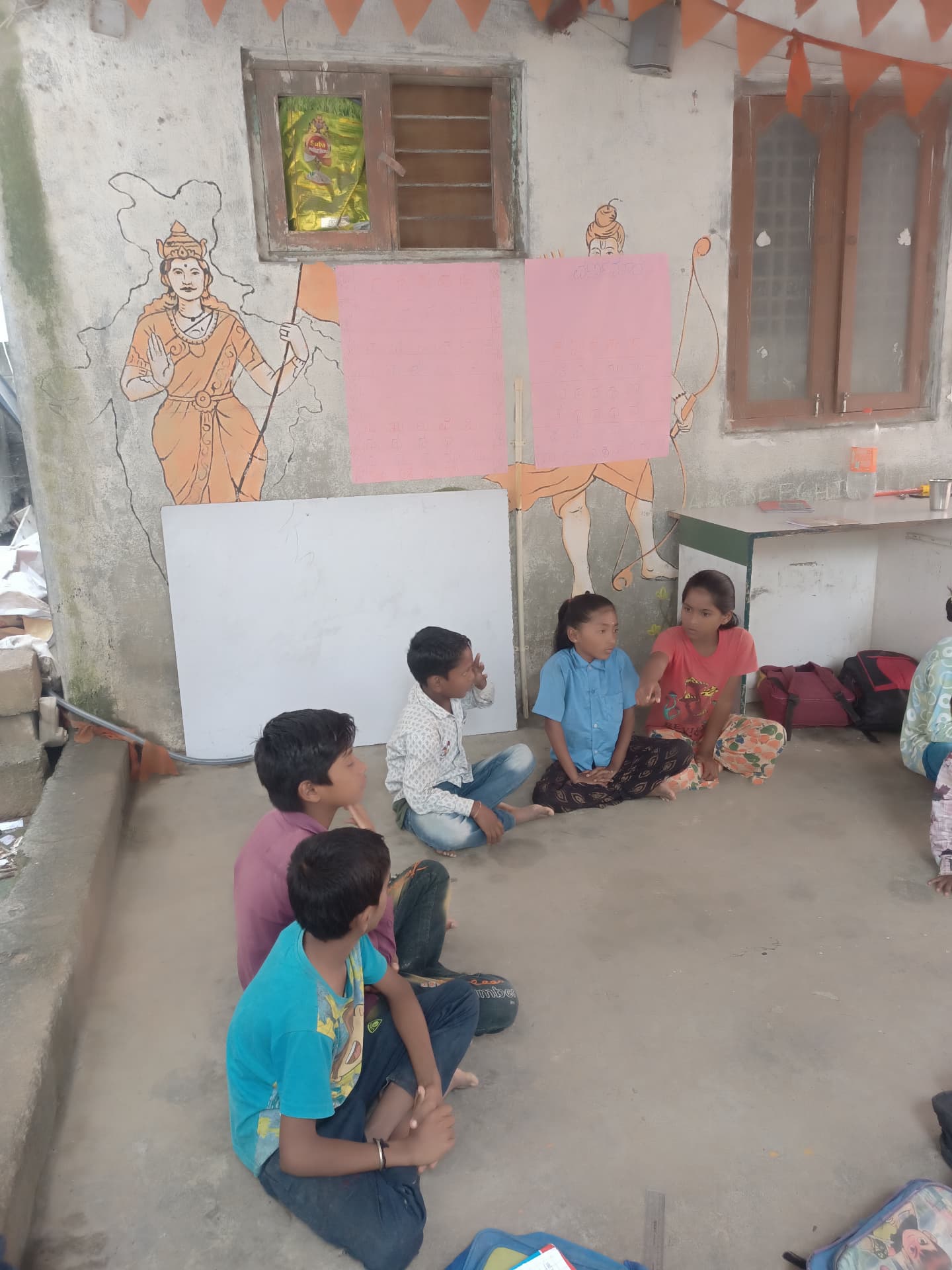 Learning session with children in front of a whiteboard