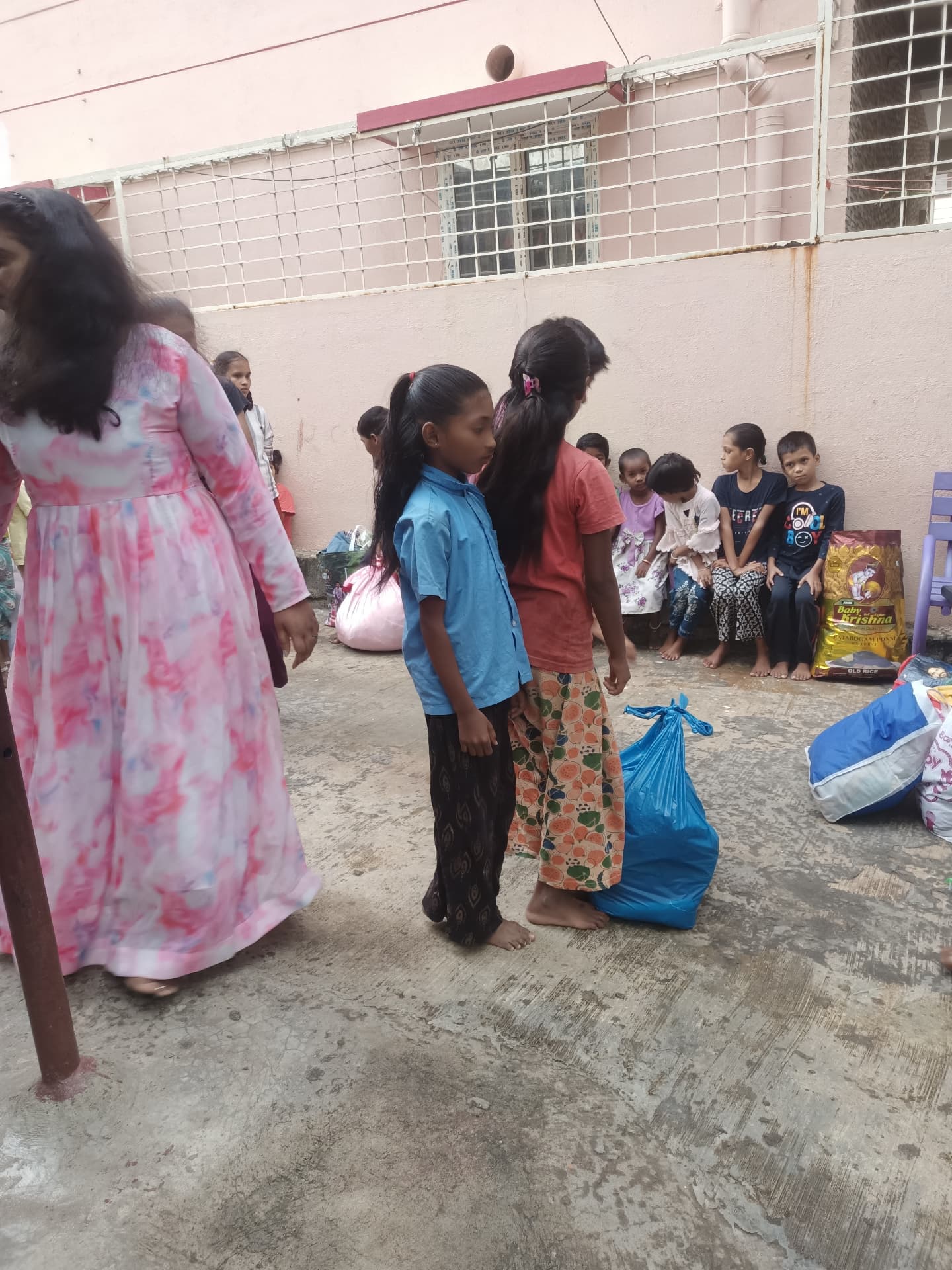 Children queuing to receive donated supplies