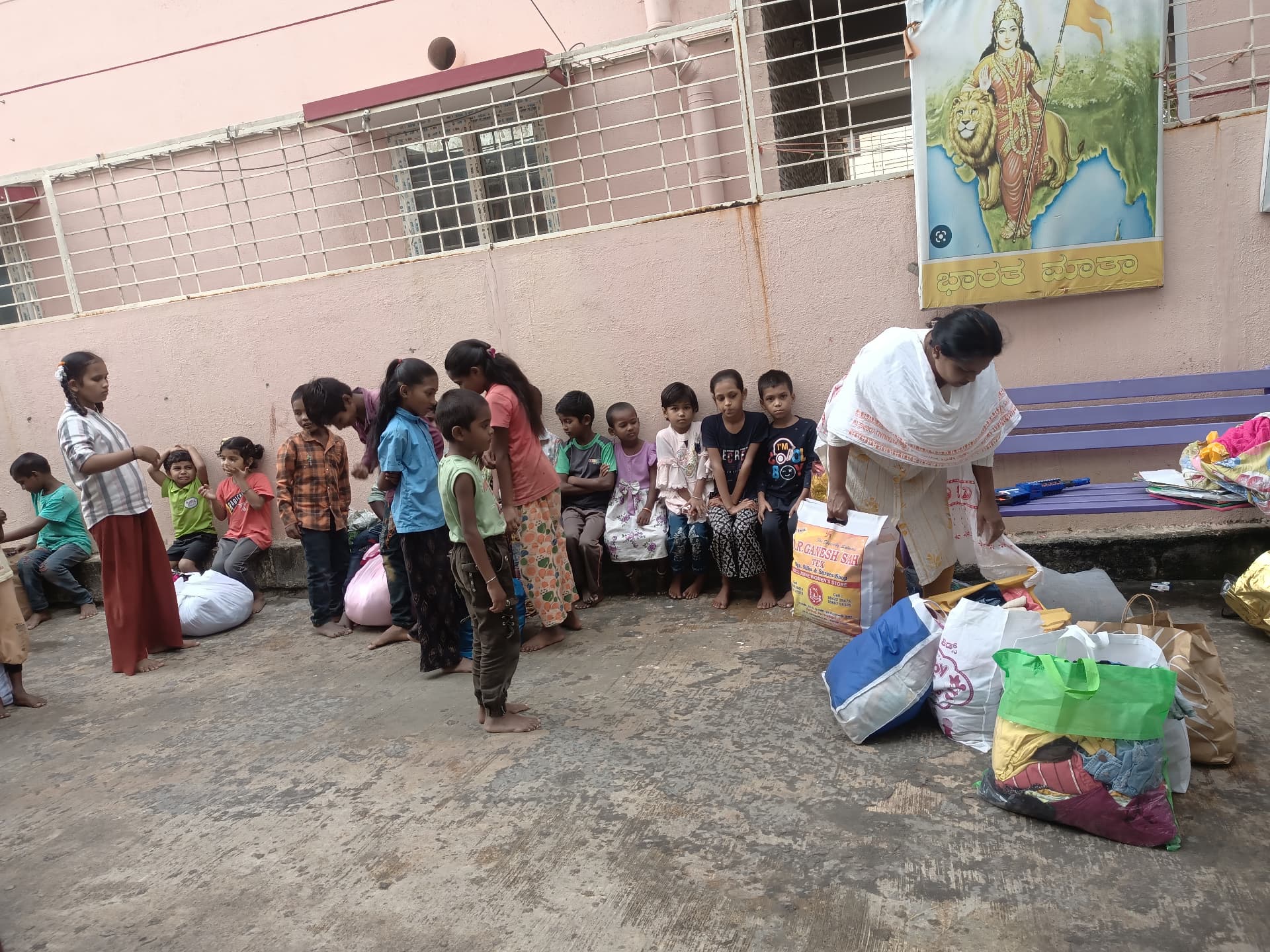 Distribution drive with clothing and grocery bags for children