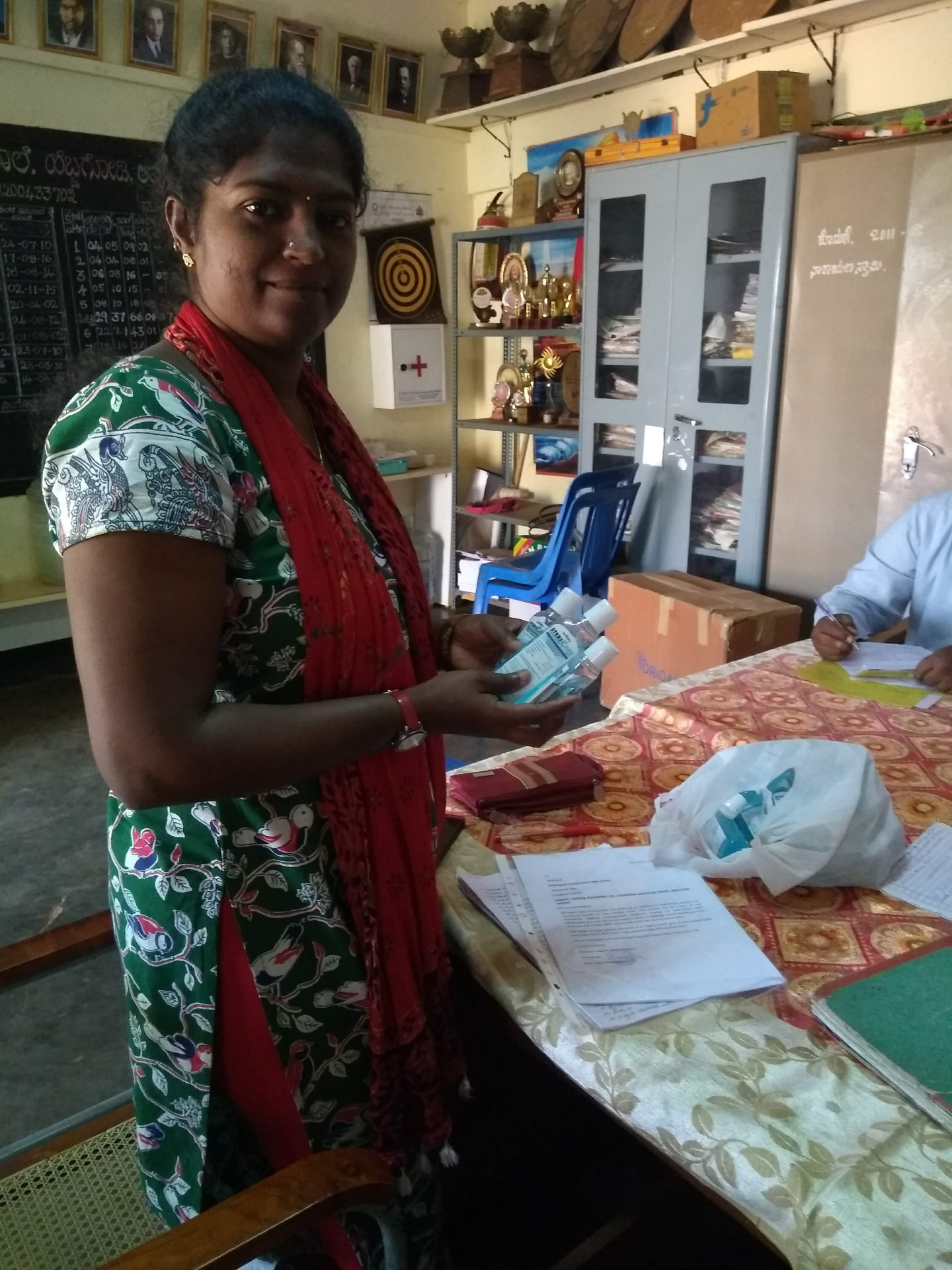 Community participant receiving hygiene supplies during a REIN India programme