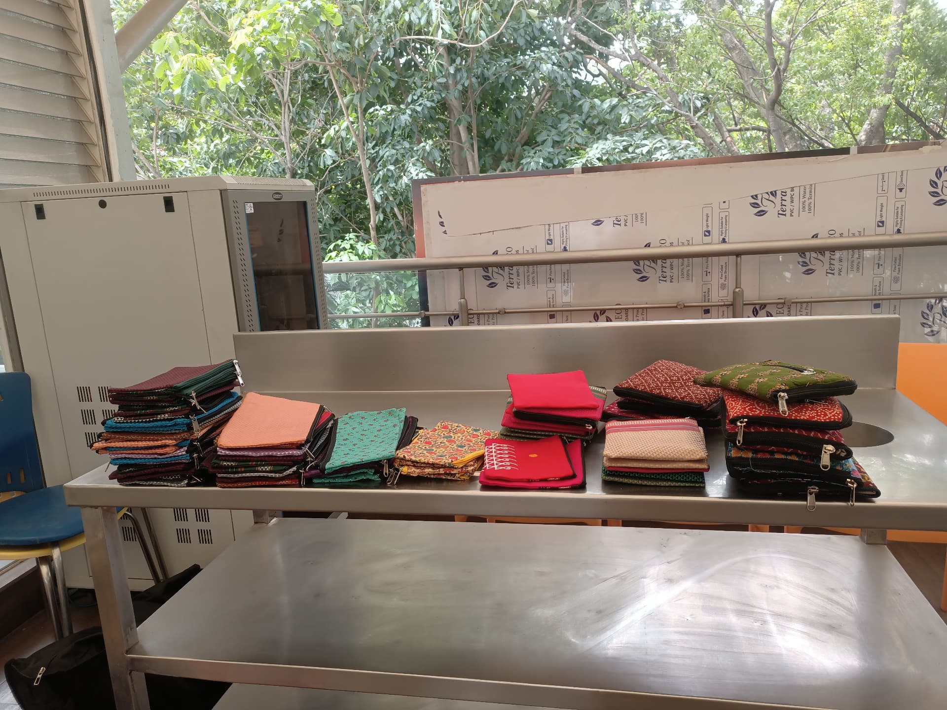 Handmade zip pouches stitched by Wings of Desire artisans on display